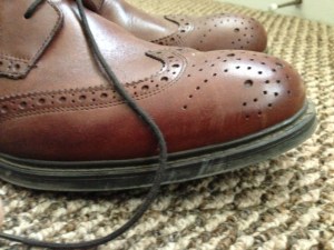 The boot style and perforations help set this shoe apart. 