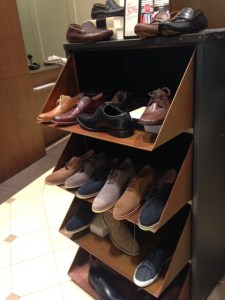 Shoes on shelves, mostly in summer suede. 