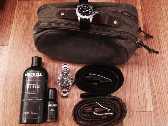 The key accessories for this trip. Pictured: J. Crew Factory Dopp Kit, Perry Ellis Black Webbed Belt, Target Merona Braided Leather Belt, Invicta & Stuhrling Watches, along with some Brickell Men's Products. 
