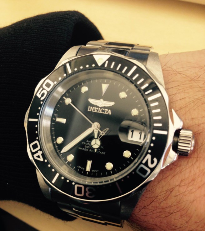 An up-close look at a versatile timepiece, the Invicta 8926 Pro Diver. Cardigan by Todd Snyder. 