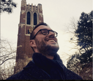 Me (Beau) posing in front, yes, Beaumont Tower on MSU's iconic campus. Overcoat by Kenneth Cole.  Scarf by J. Crew Factory. Glasses by Warby Parker. 