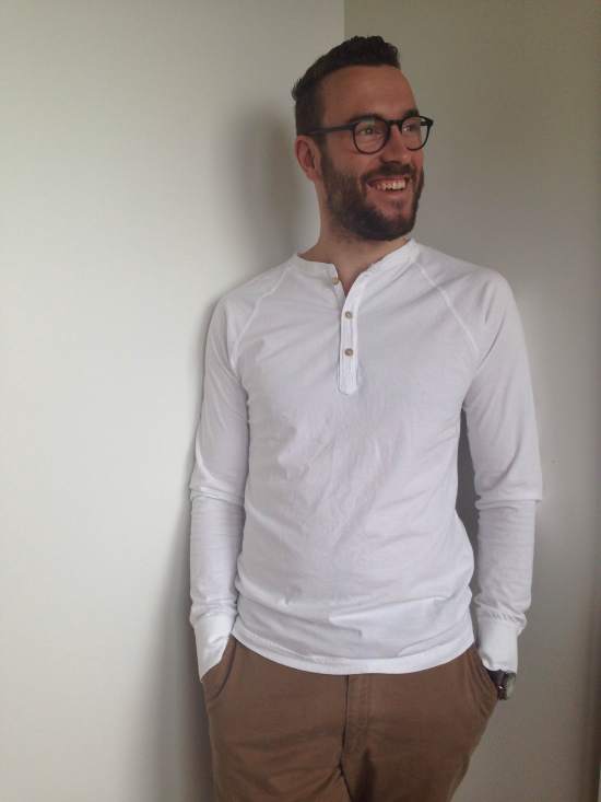 Up-close with Pistol Lake's white henley. Watch by Timex, Horween watch strap by Form-Function-Form. Chinos by Frank & Oak. Glasses by Warby Parker. 