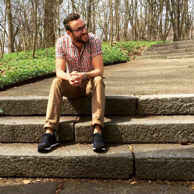 The GREATS Rosen Runner — a perfect casual sneaker for high-low wear. Short-sleeve mini-check shirt by H&M. Khaki chinos by Frank & Oak. Silver dive watch by Invicta. Glasses by Warby Parker.