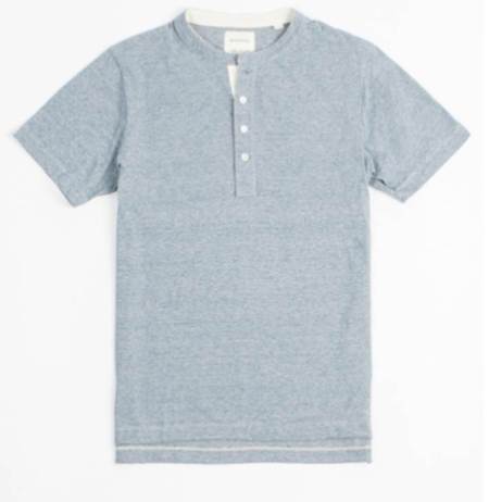 A cool sky or (Steel) blue color and designer details like Mother of Pearl buttons make this a standout piece.