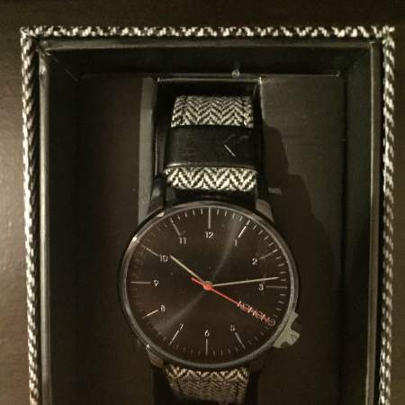 An appropriately-fitting patterned case accompanies KOMONO's Winston Herringbone Watch.