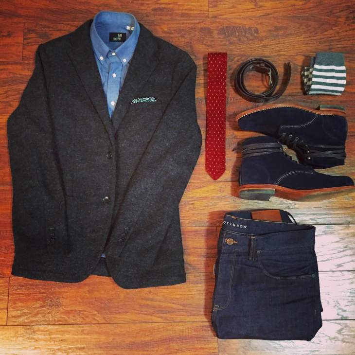 Todd Shelton's chambray shirt pairs well with other style staples. Charcoal wool blazer by UNIQLO. Raw dark denim by Mott & Bow. Navy suede 1000 Mile boots by Wolverine. Knit tie by 15ties. Striped socks by American Trench. Belt & floral pocket square by J. Crew. 