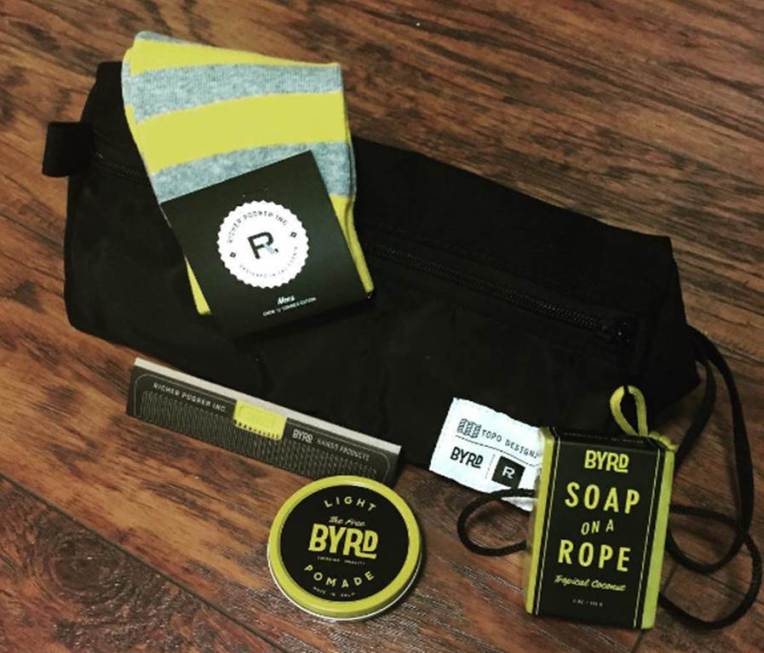 The trusty toiletries kit I'll be taking with me -- including a sharp pomade, a slick styling comb, "soap-on-a-rope" and some Richer Poorer socks.