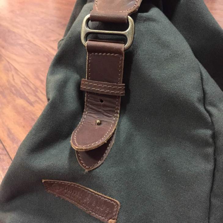 Brass hardware pairs well with the dark brown genuine leather straps. 