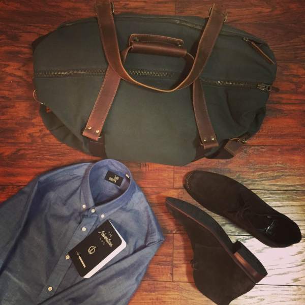 Ready to hit the road with the Mt. Drew Duffle. Natural chambray shirt by Todd Shelton. Chocolate Suede Scout Chukka Boots by Thursday Boot Company. Adventure Log by Word Notebooks.