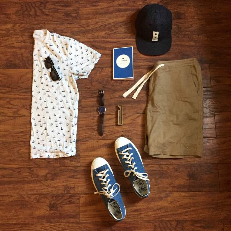 Can't go wrong with a printed tee and slim shorts in warm weather. Stringer Dune Shorts and Flat Wool Cap by Bridge & Burn. Printed T-shirt by J. Crew. Sneakers by The Hill-Side. Brown leather watch by MVMT Watches. Field Guide by Wildsam. Brass bottle opener by Owen & Fred. 
