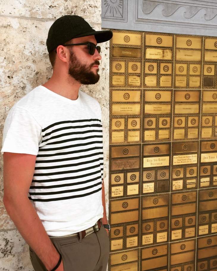 The Sydney & Berne Davis Art Center in downtown Fort Myers. Breton Stripe Tee by Grayers. Colter Pants by Stio. Sunglasses by Nautica. Flat Wool Cap by Bridge & Burn. Striped webbed belt by J. Crew. Mod Watch by Timex x Todd Snyder. Bracelet by Bryer Leather.