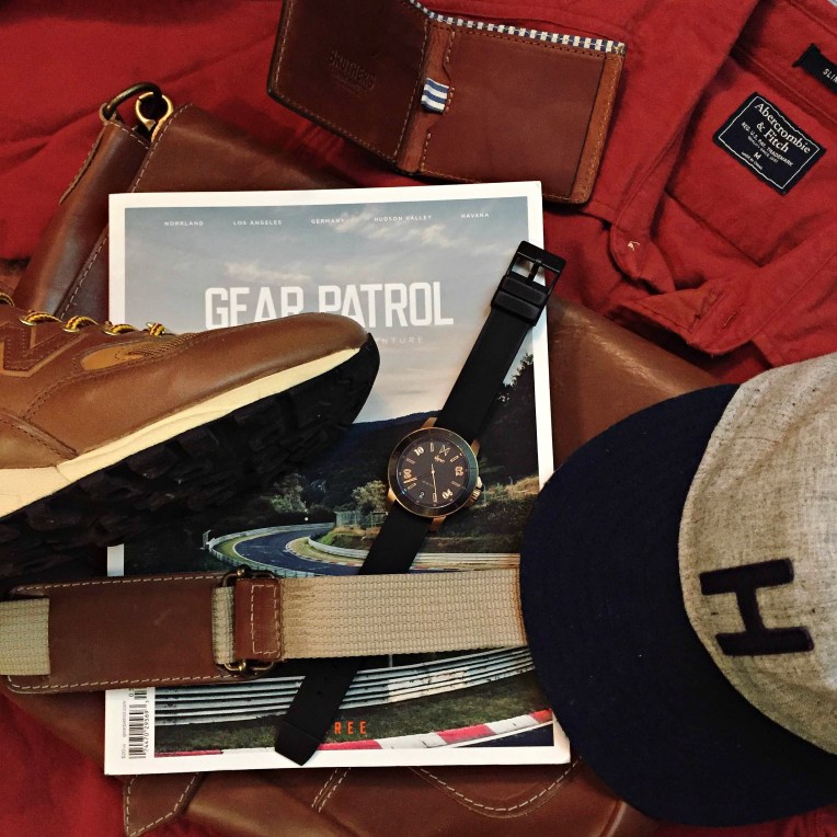 Travel essentials fit for hitting the road and fighting the cold. Chamois Shirt by Abercrombie & Fitch. Explorer's Cap by Huckberry. Messenger bag and 810 Wallet by Brothers Leather. Calypso Watch by MVMT Watches. miUSA 585 Sneakers by New Balance. Magazine by Gear Patrol.